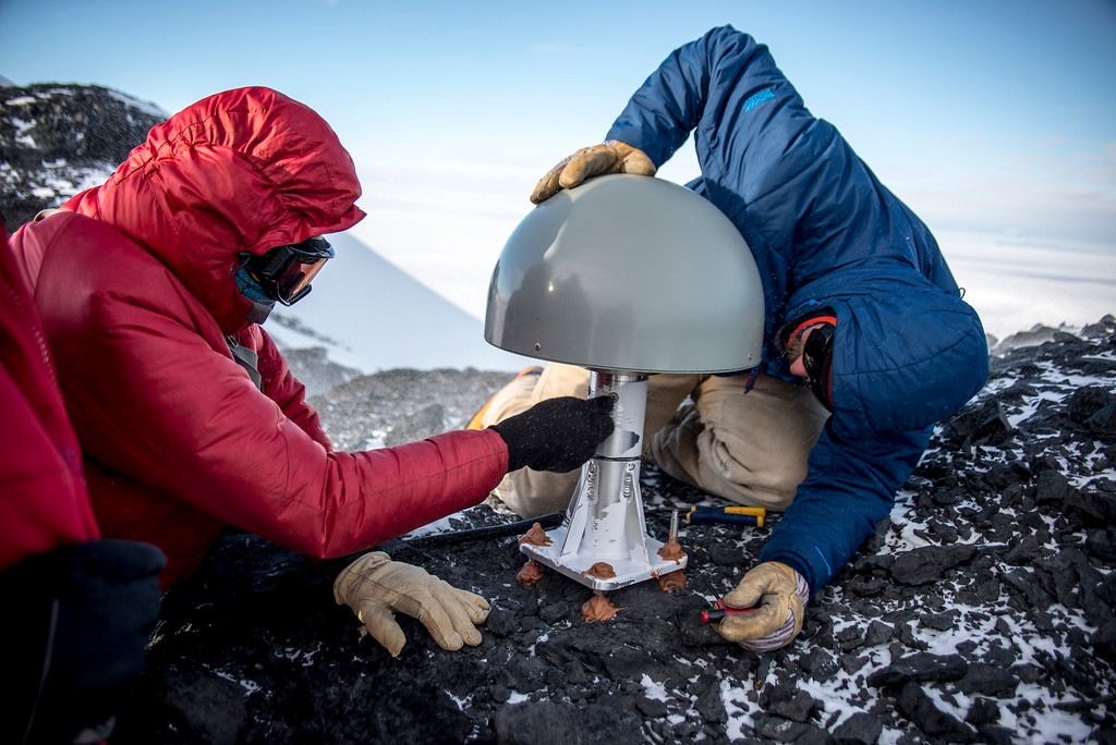 Inspecting the GPS antenna at Toney Mountain.jpg